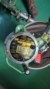 Handheld MMC Asia UTI D‑2401‑2 portable ullage temperature interface gauge with graduated tape, showing ullage, temperature display and interface detection sensor.