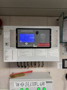 Brannstrom Cleantrack 1000B oil discharge monitor control unit installed on board a vessel showing operational display and certification labels during service inspection