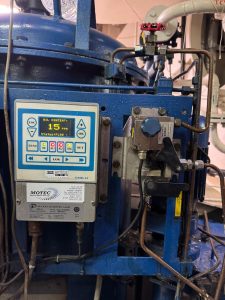 Deckma OMD-24 oil content monitor showing 15 ppm alarm status during onboard calibration using OEM calibration kit, performed in Spanish ports including Algeciras, Gibraltar, Huelva, Cartagena, Barcelona, and Bilbao.