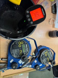 Portable UTI marine gauging instruments undergoing calibration and full function testing on board using OEM approved equipment.