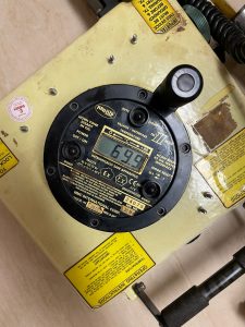 MMC D-2401-2 UTI temperature and interface gauge displaying temperature reading during calibration service onboard in Spain including Algeciras, Gibraltar, Huelva, Cartagena, Barcelona, and Bilbao.
