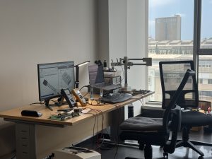 Repaired marine electronic control PCBs including power supply, digital I/O, and CPU boards undergoing testing after component replacement.