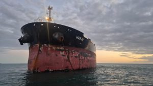 Large tanker vessel at anchorage during onboard calibration and technical service operations in Spain including Algeciras, Gibraltar, Huelva, Cartagena, Barcelona, and Bilbao.