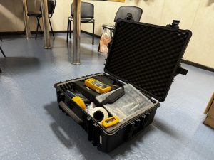 Portable calibration instruments and tools arranged in a protective case onboard a tanker, used for onboard calibration services in Spain including Algeciras, Gibraltar, Huelva, Cartagena, Barcelona, and Bilbao.