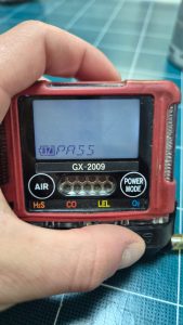 RKI Riken Keiki GX-2009 personal gas detector showing pass status during calibration and functional testing, serviced onboard during anchorage operations in Spain including Algeciras, Gibraltar, Huelva, Cartagena, Barcelona, and Bilbao.
