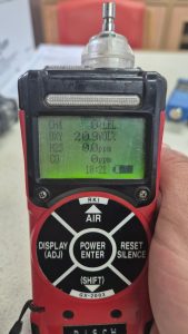 RKI Riken Keiki GX2003 portable marine gas detector showing calibrated readings for O2, LEL, H2S, and CO during service check